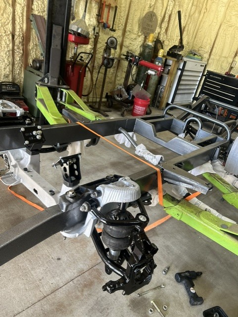 Chassis rail with front suspension components being fabricated