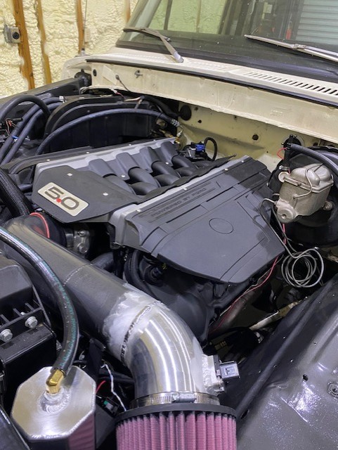 Ford Coyote 5.0 engine swap with cold air intake in a classic truck