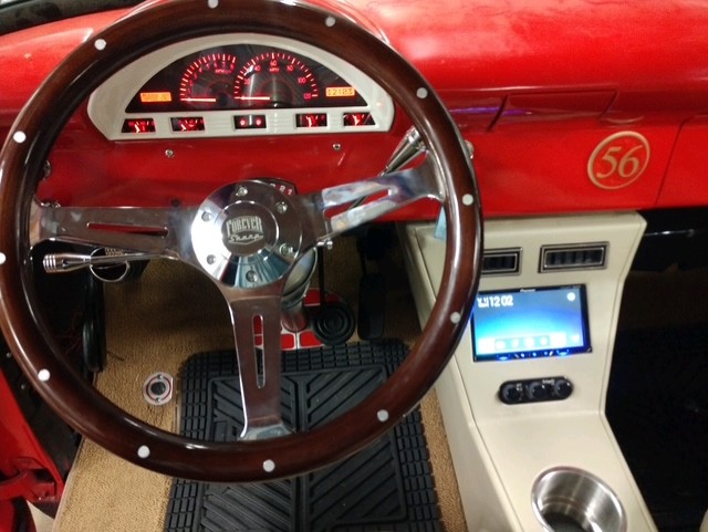 Custom wood steering wheel and digital gauge cluster in a 1956 Ford F-100